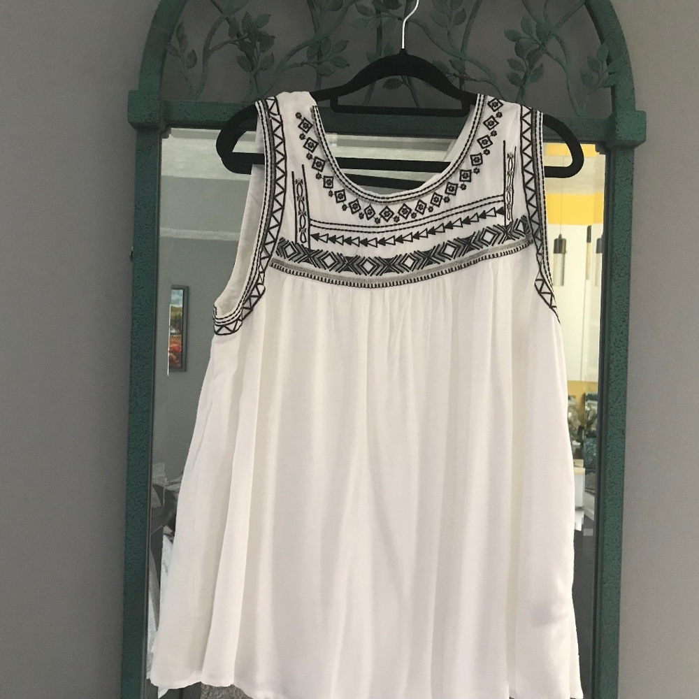 Lane Bryant top. White with black trim around the neck. Size 18.